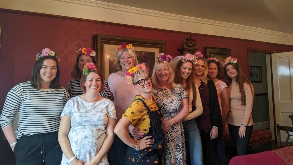 Group of ladies wearing flower crowns